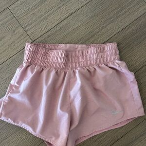 Pink Nike running shorts